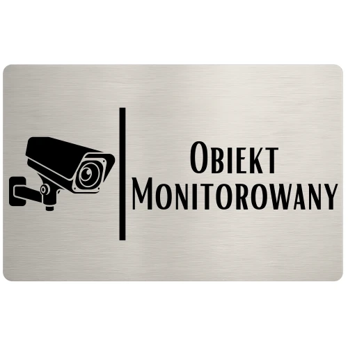 Tabliczka informująca o monitoringu wizyjnym na posesji.