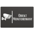 Oznaczenie informujące o monitoringu przy drzwiach wejściowych.