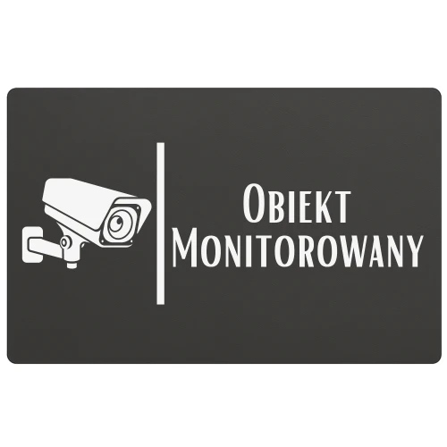 Oznaczenie informujące o monitoringu przy drzwiach wejściowych.