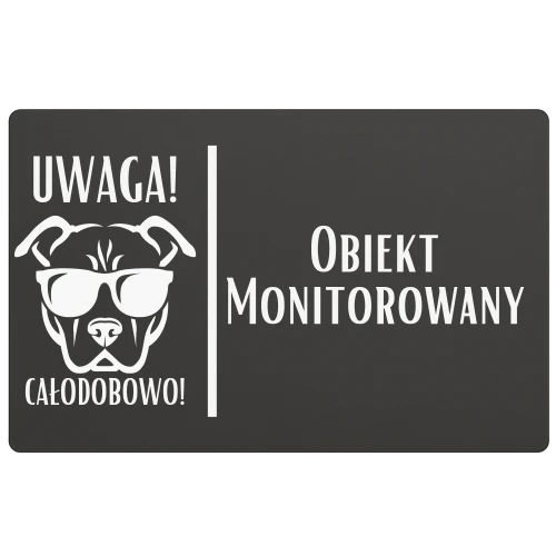 Tablica z napisem „Obiekt monitorowany” i grafiką psa z kamerą.
