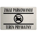 Tabliczka ostrzegawcza z napisem „Teren prywatny – zakaz parkowania”.