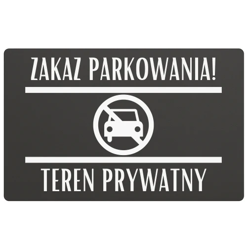 Tabliczka zakazująca zatrzymywania się przy bramie garażowej.