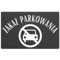 Tablica z wyraźnym, kontrastowym napisem o zakazie parkowania.
